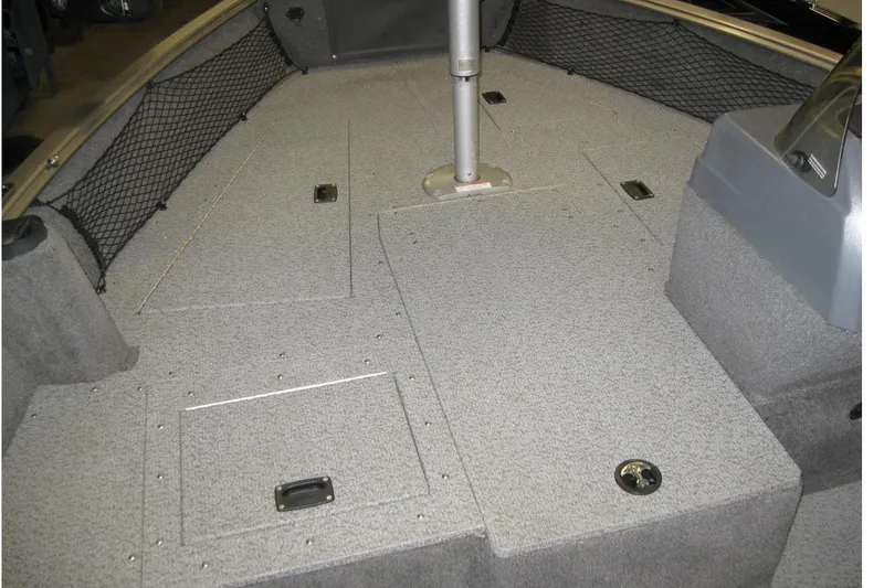 Slide: The Image of 2016 Lund 1775 Impact SS boat interior with storage compartments and netting. - 17