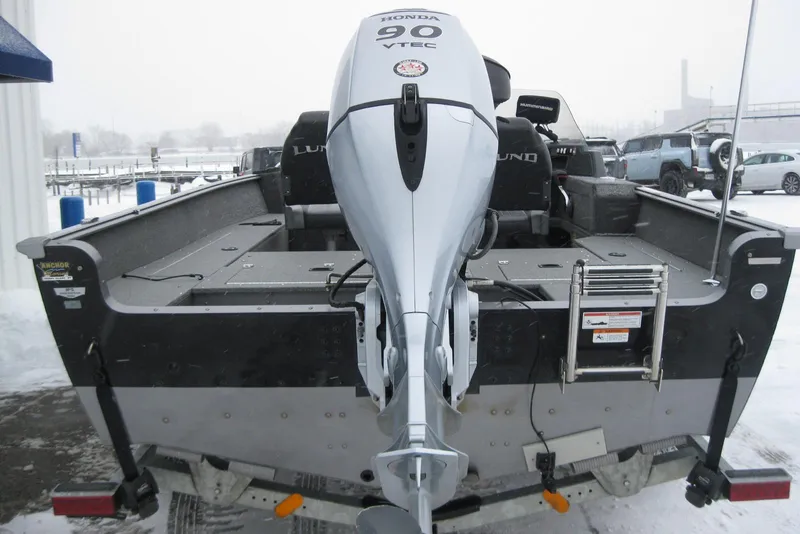 Slide: The Image of 2016 Lund 1775 Impact SS boat with Honda 90 VTEC outboard motor in snowy setting. - 4