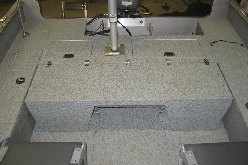 Slide: The Image of 2016 Lund 1775 Impact SS boat interior with storage compartments and seating. - 6