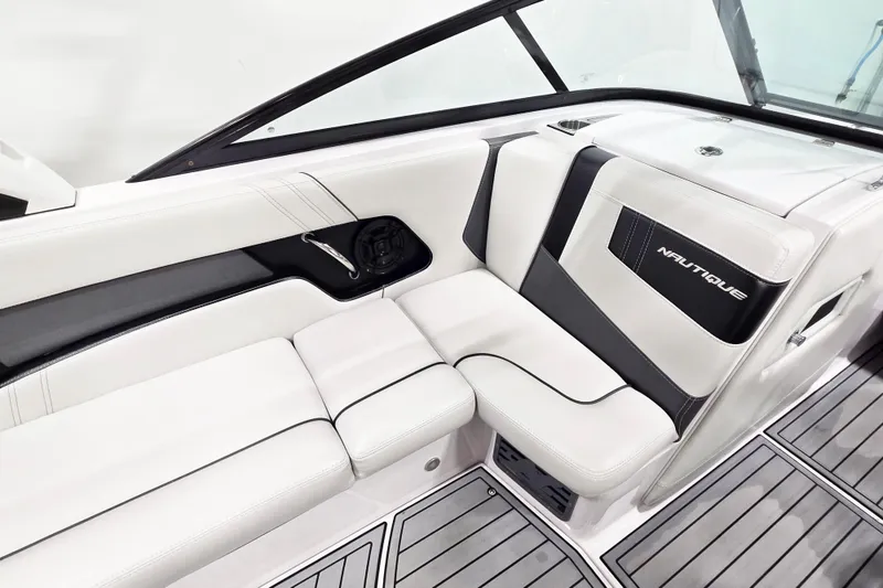 Slide: The Image of 2014 Nautique Super Air Nautique 210 interior with sleek white and black seating. - 28