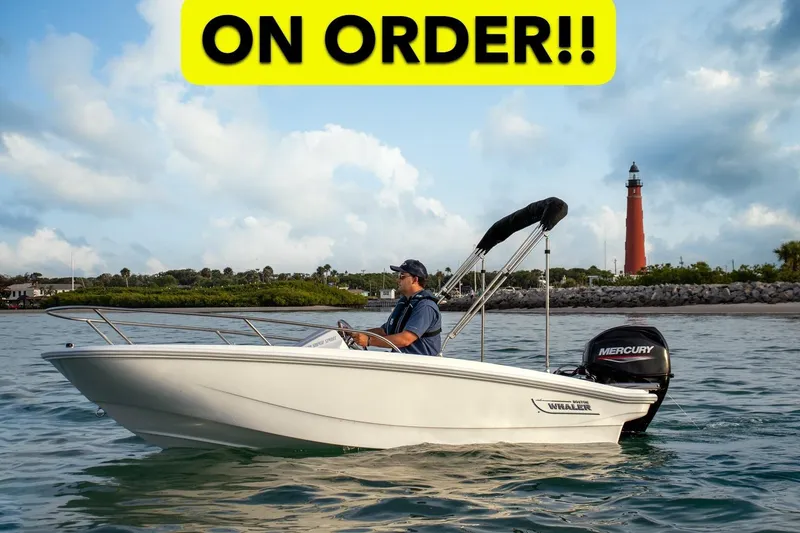 The Image of 2026 Boston Whaler 130 Super Sport boat on water, lighthouse in background, "On Order" text. - 0