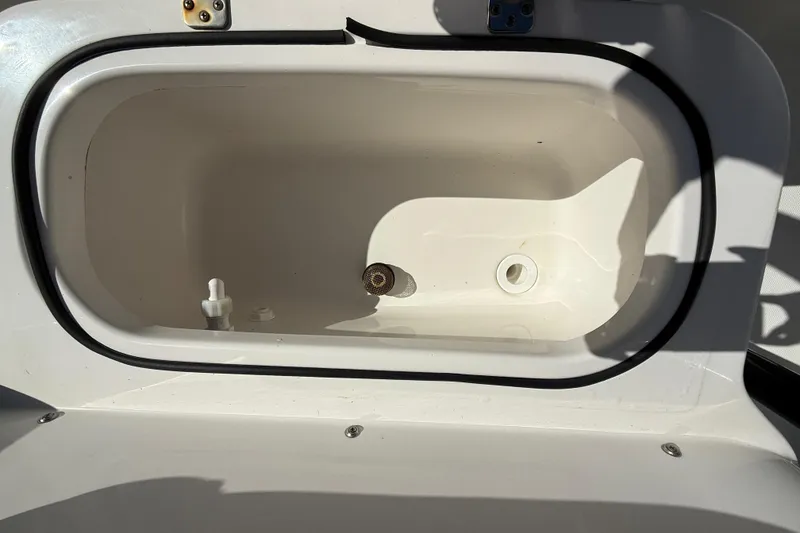 Slide: The Image of Livewell compartment in 2022 NauticStar 231 Hybrid boat, open and empty. - 32