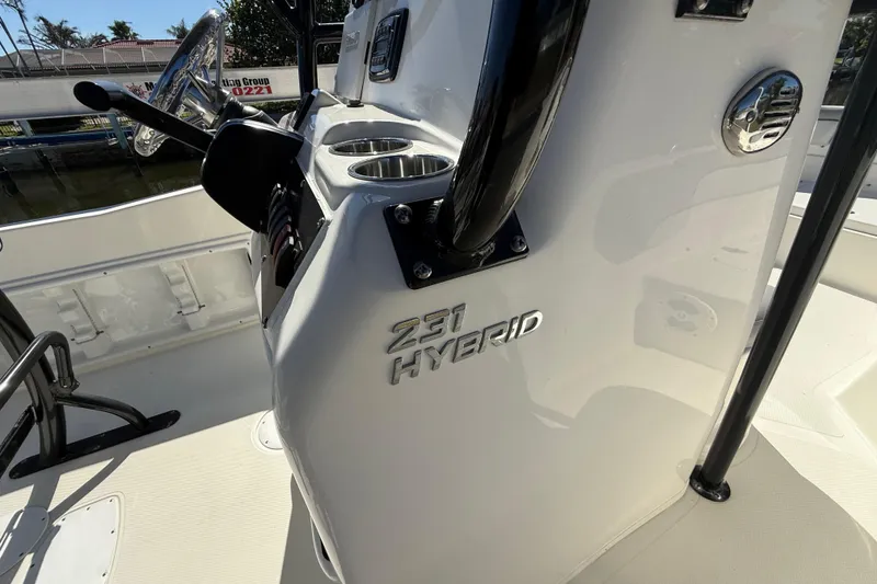 Slide: The Image of 2022 NauticStar 231 Hybrid boat interior with steering wheel and console details. - 35