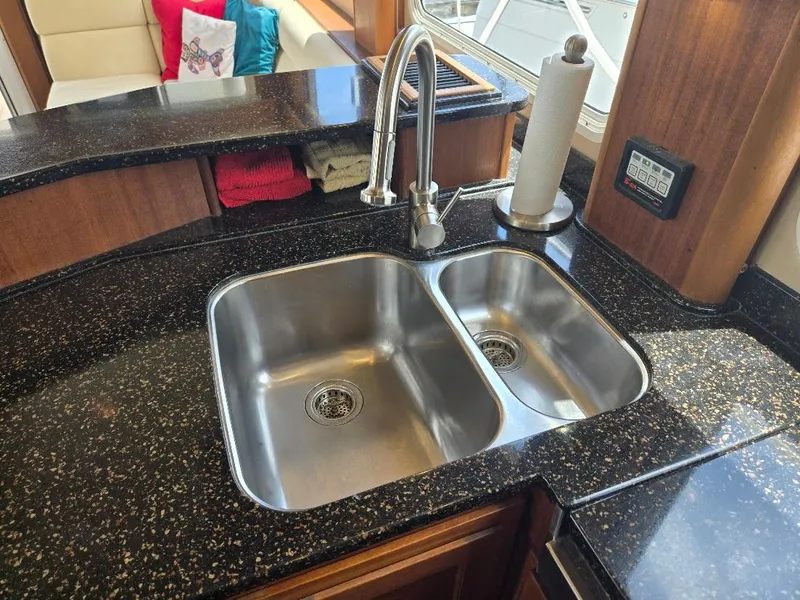 Slide: The Image of Stainless steel double sink in 2010 American Tug 49 Limited yacht kitchen. - 24