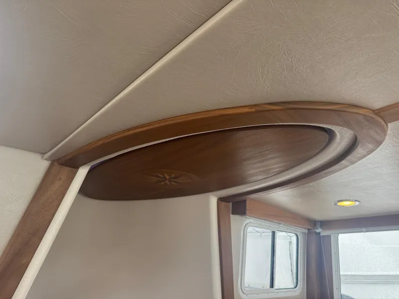 Slide: The Image of Interior ceiling detail of 2010 American Tug 49 Limited with wooden circular design. - 33
