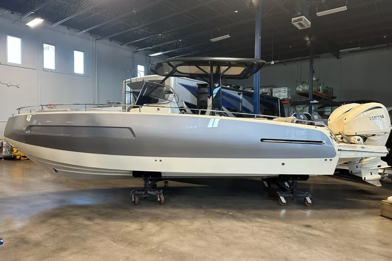 The Image of 2024 Invictus TT280S boat in showroom, featuring sleek design and Yamaha engines. - 1