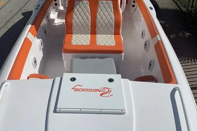 Slide: The Image of 2006 Renegade 32 Cuddy boat interior with orange and white seating. - 15