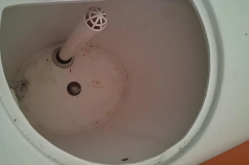 Slide: The Image of 2006 Renegade 32 Cuddy boat compartment interior, showing a white cylindrical structure. - 19