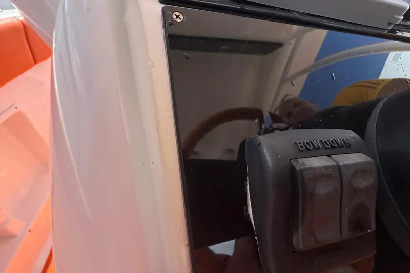 Slide: The Image of 2006 Renegade 32 Cuddy boat dashboard with "Bow Down" control switch. - 23