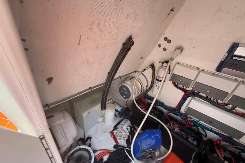 Slide: The Image of 2006 Renegade 32 Cuddy boat interior wiring and equipment storage area. - 34