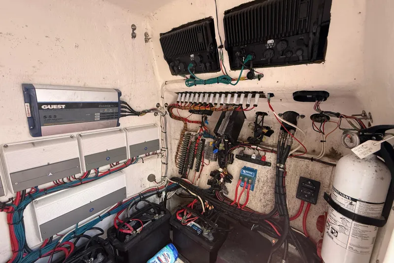 Slide: The Image of Electrical system of a 2006 Renegade 32 Cuddy boat, featuring wiring and components. - 35