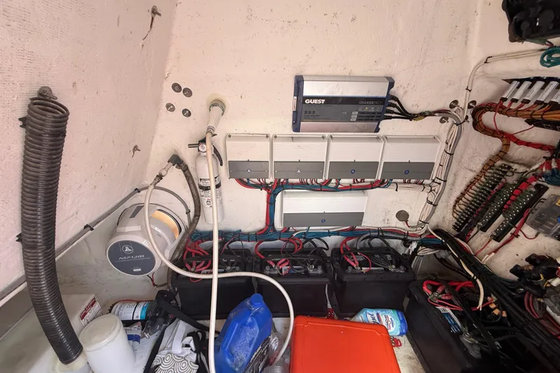 Slide: The Image of Electrical system of a 2006 Renegade 32 Cuddy boat, featuring batteries and wiring. - 36