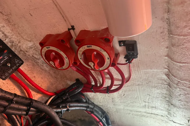 Slide: The Image of Electrical switches and wiring inside a 2006 Renegade 32 Cuddy boat. - 37