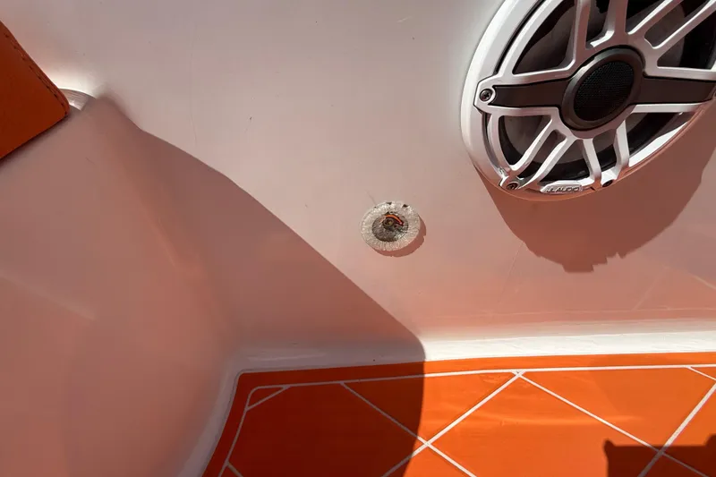 Slide: The Image of 2006 Renegade 32 Cuddy boat interior with speaker and orange flooring. - 47