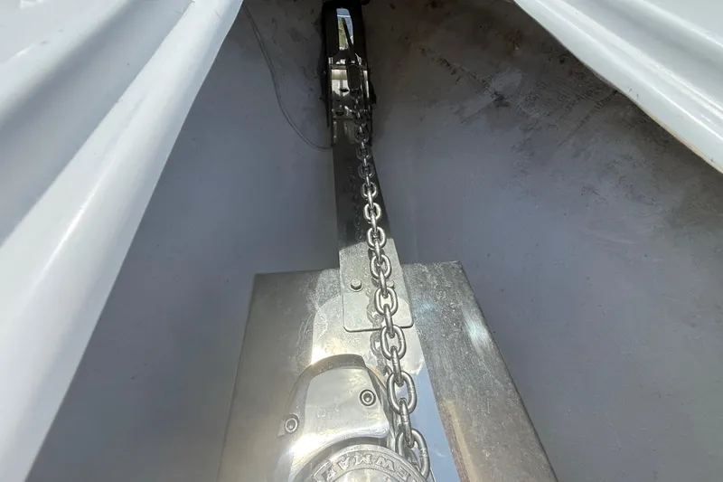 Slide: The Image of Anchor chain mechanism on a 2006 Renegade 32 Cuddy boat. - 54