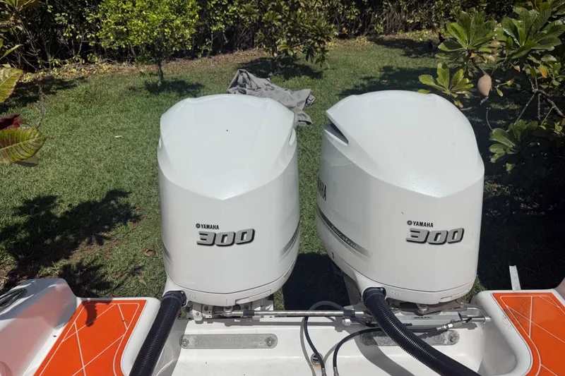 Slide: The Image of Twin Yamaha 300 outboard engines on a 2006 Renegade 32 Cuddy boat. - 59