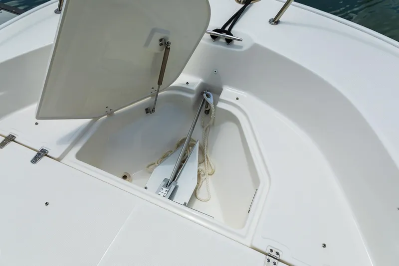 Slide: The Image of 2026 Boston Whaler 190 Montauk boat console with steering wheel and controls. - 3