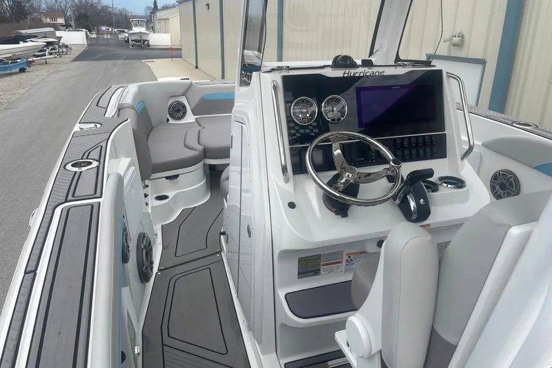 Slide: The Image of 2025 Hurricane Center Console 24 OB boat interior with modern dashboard and seating. - 17