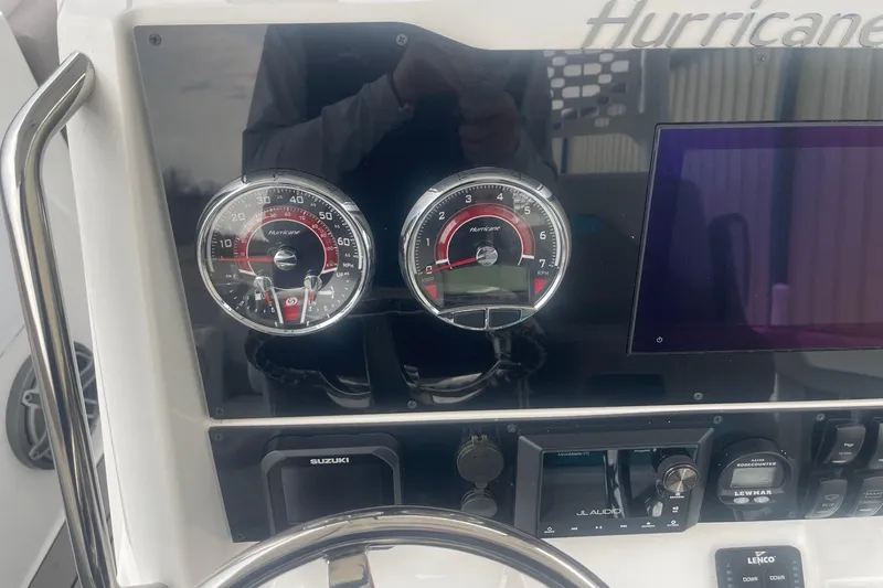 Slide: The Image of Dashboard of 2025 Hurricane Center Console 24 OB boat with gauges and controls. - 21