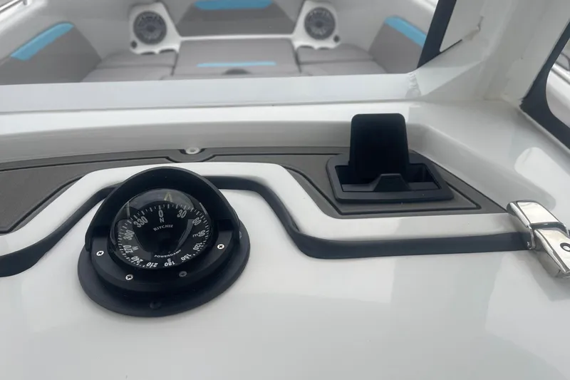 Slide: The Image of Compass and dashboard of 2025 Hurricane Center Console 24 OB boat. - 23