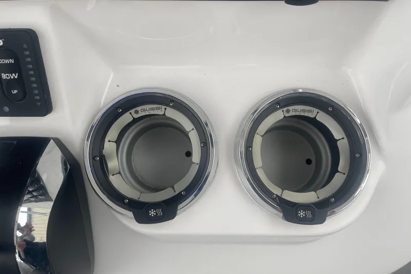 Slide: The Image of Dual cup holders on 2025 Hurricane Center Console 24 OB boat dashboard. - 26