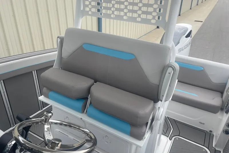 Slide: The Image of 2025 Hurricane Center Console 24 OB boat interior with gray and blue seating. - 28