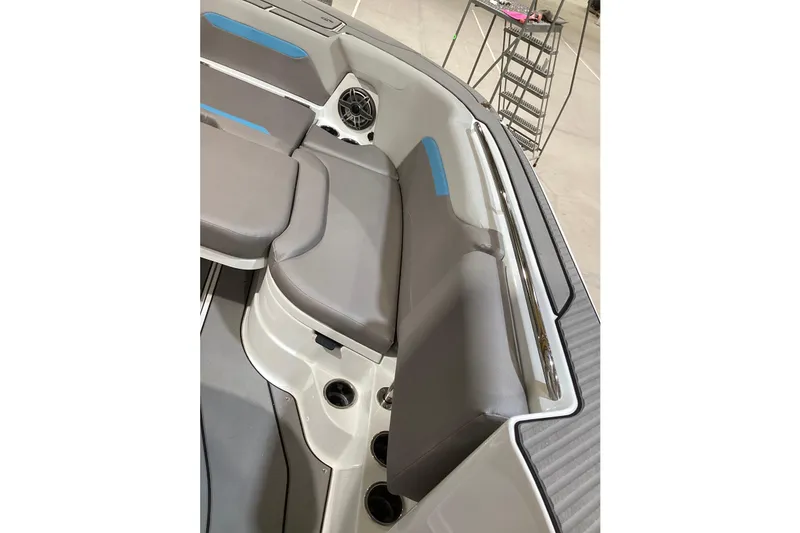 Slide: The Image of 2025 Hurricane Center Console 24 OB boat interior with gray seating and cup holders. - 3