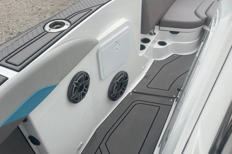 Slide: The Image of 2025 Hurricane Center Console 24 OB boat interior with speakers and seating. - 31