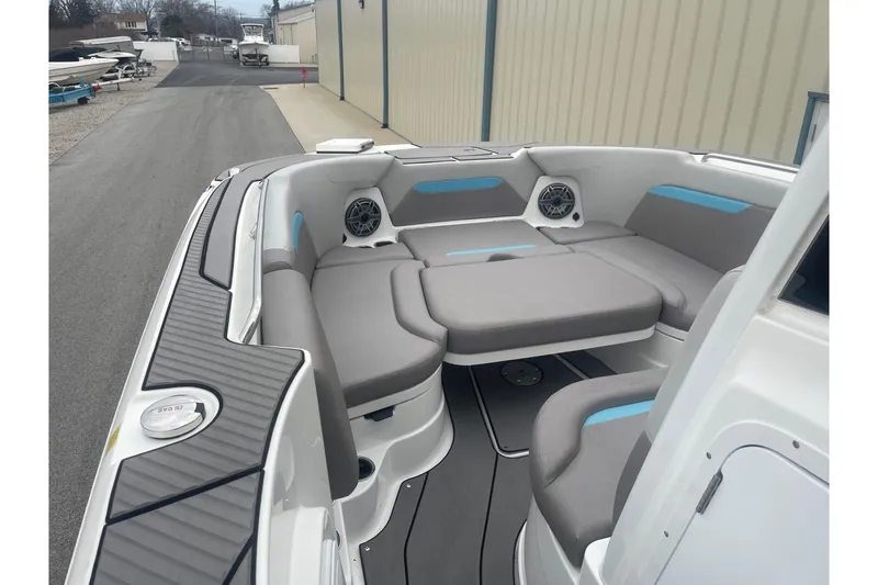 Slide: The Image of 2025 Hurricane Center Console 24 OB boat interior with gray seating and modern design. - 35