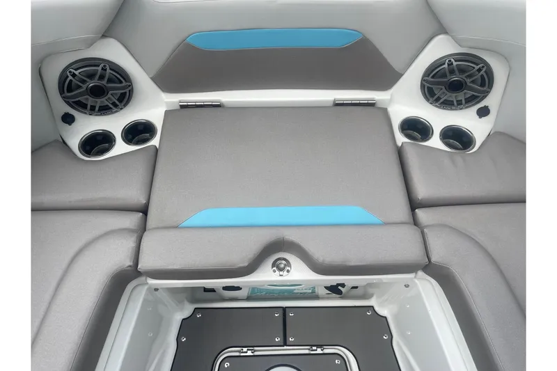 Slide: The Image of 2025 Hurricane Center Console 24 OB boat interior with speakers and cushioned seating. - 42