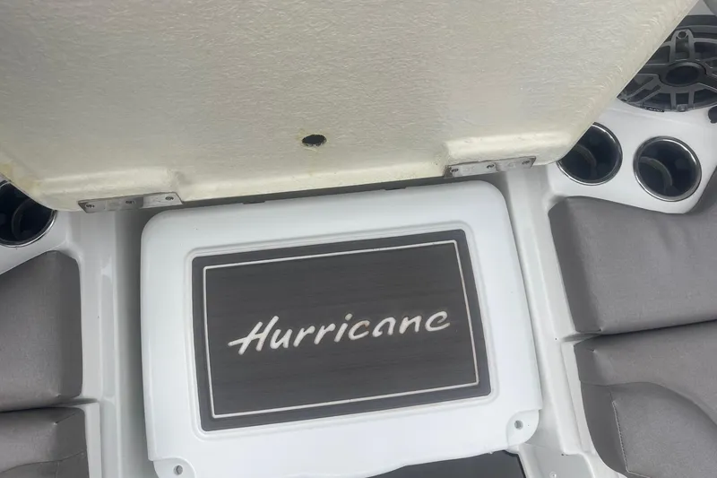 Slide: The Image of 2025 Hurricane Center Console 24 OB boat interior with logo and cup holders. - 43