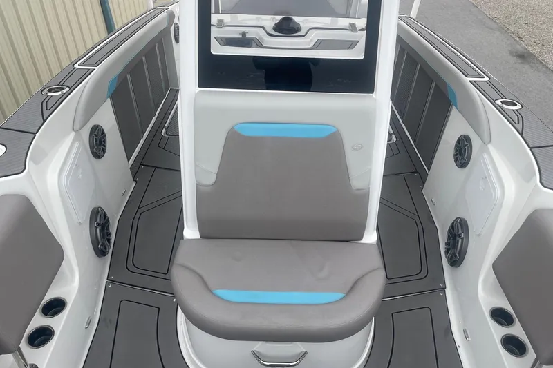 Slide: The Image of 2025 Hurricane Center Console 24 OB boat interior with seating and speakers. - 45