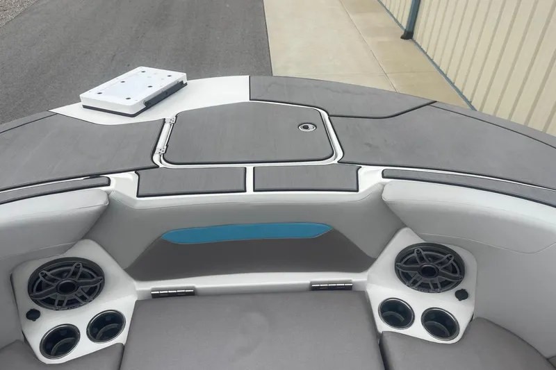 Slide: The Image of 2025 Hurricane Center Console 24 OB boat interior with speakers and storage compartments. - 46