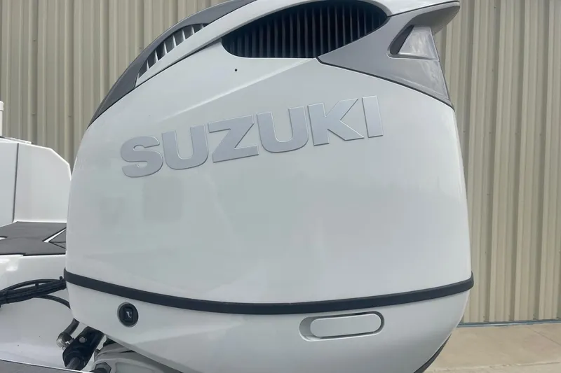Slide: The Image of 2025 Hurricane Center Console 24 OB with Suzuki outboard motor. - 48
