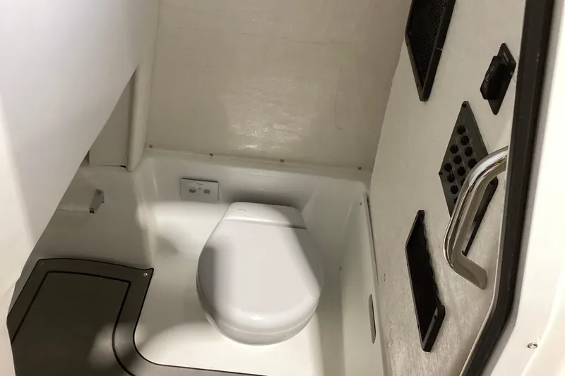 Slide: The Image of Interior of 2025 Hurricane Center Console 24 OB boat bathroom with modern fixtures. - 5