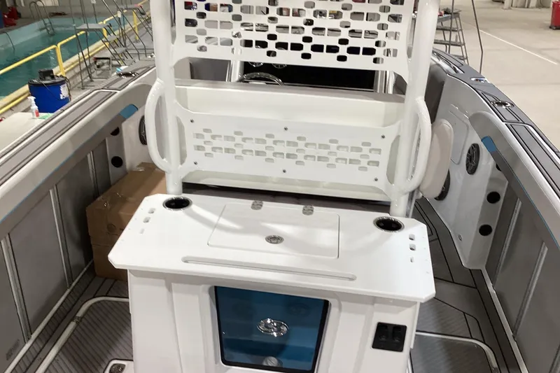 Slide: The Image of 2025 Hurricane Center Console 24 OB boat interior with seating and storage features. - 7
