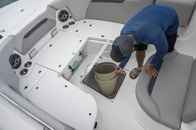 Slide: The Image of 2025 Hurricane Center Console 24 OB boat interior with storage compartment and seating. - 8