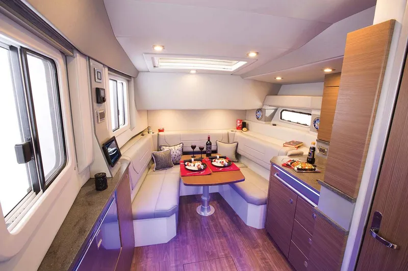 Slide: The Image of Manufacturer Provided Image: 2018 Formula 430 Super Sport Crossover interior dining area with modern amenities. - 17