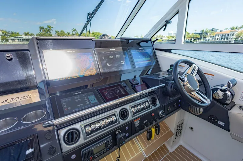 Slide: The Image of 2018 Formula 430 Super Sport Crossover helm with advanced navigation displays and controls. - 19