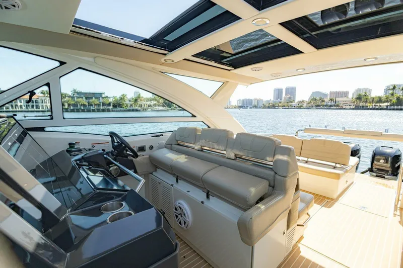 Slide: The Image of Interior of 2018 Formula 430 Super Sport Crossover yacht with luxurious seating and waterfront view. - 21