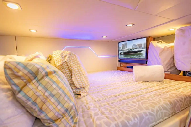 Slide: The Image of Luxurious cabin interior of 2018 Formula 430 Super Sport Crossover with cozy bedding and TV. - 29