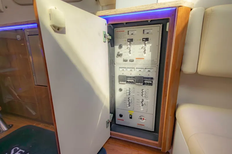 Slide: The Image of Electrical panel inside 2018 Formula 430 Super Sport Crossover boat, open cabinet view. - 30