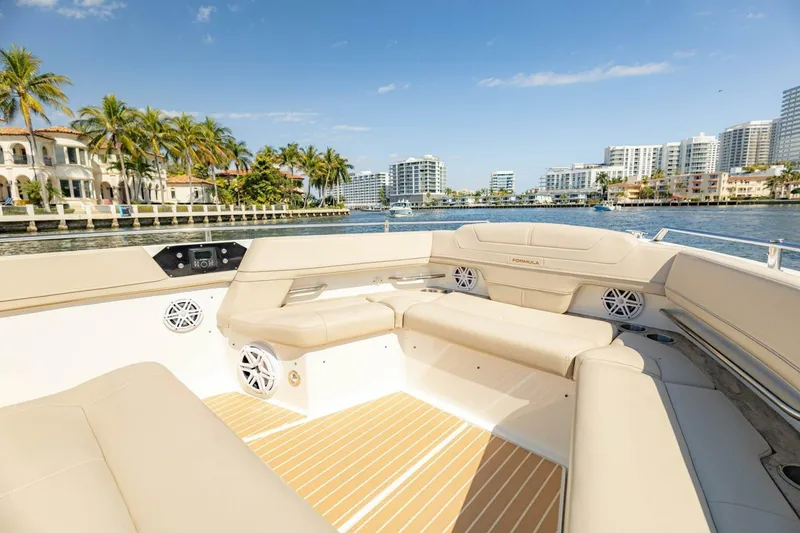 Slide: The Image of 2018 Formula 430 Super Sport Crossover boat interior with luxurious seating, waterfront view. - 33