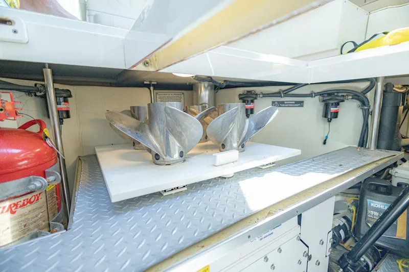 Slide: The Image of Engine room of 2018 Formula 430 Super Sport Crossover with propellers and fire extinguisher. - 41