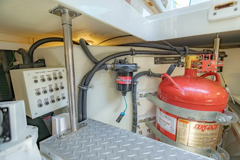 Slide: The Image of Engine compartment of 2018 Formula 430 Super Sport Crossover with fire extinguisher and control panel. - 44