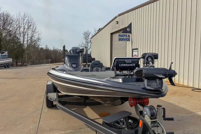 Slide: The Image of 2019 Skeeter ZX200 boat parked outside service center. - 12