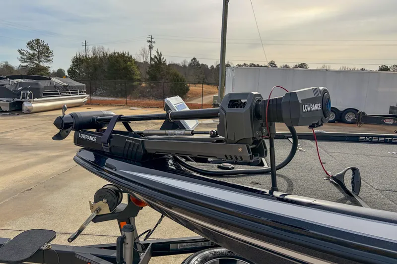 Slide: The Image of 2019 Skeeter ZX200 boat with Lowrance Ghost trolling motor in a parking lot. - 5