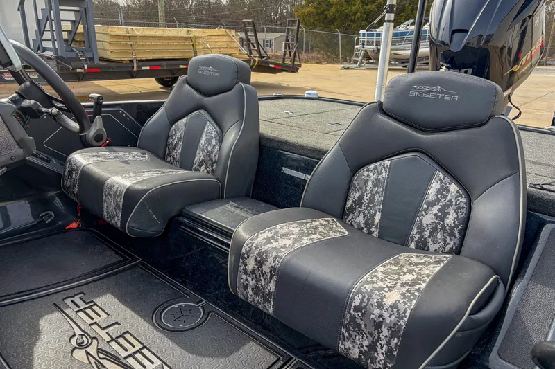 Slide: The Image of 2019 Skeeter ZX200 boat interior with camo-patterned seats and steering wheel. - 7