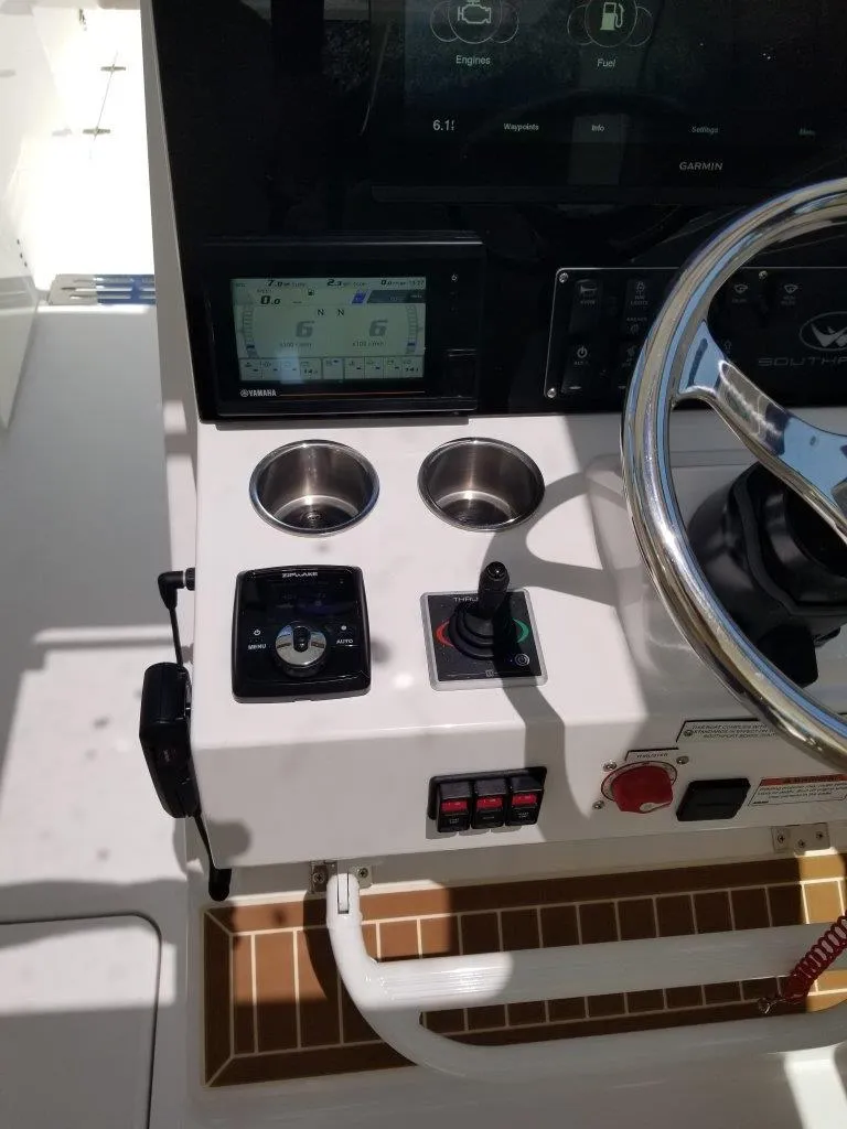 Slide: The Image of 2021 Southport 33 DC helm with modern controls and steering wheel. - 11