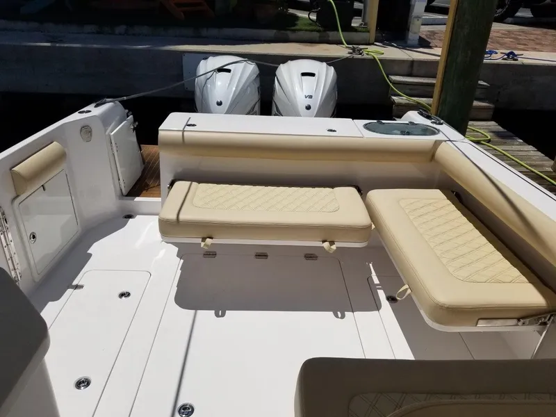 Slide: The Image of Interior of a 2021 Southport 33 DC boat with beige seating. - 5